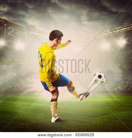 soccer or football player is kicking ball on stadium