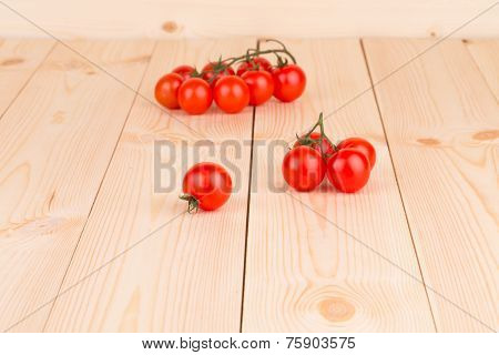 Ripe Fresh Cherry Tomatoes on the wooden desk