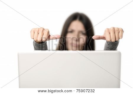 Unhappy Young Woman Showing Thumbs On Sides