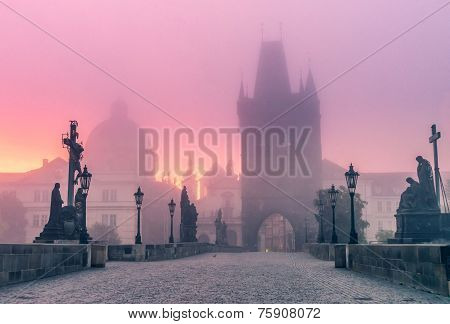 Charles Bridge In Foggy Morning In Prague