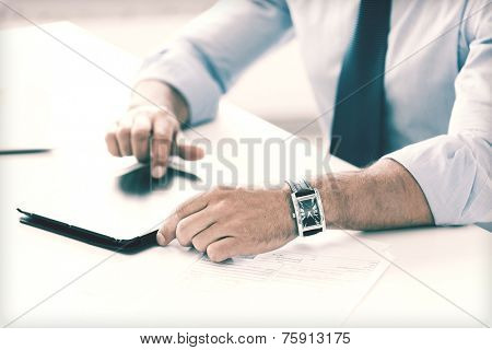 business, office, school and education concept - businessman with tablet pc in office