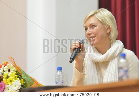 NOVOSIBIRSK, RUSSIA - NOVEMBER 8, 2014: World champion in boxing Natalia Ragozina talk with children. The meeting dedicated to the Friendship Cup and aimed to promote the sport