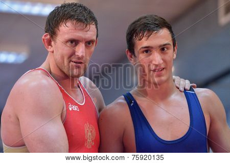NOVOSIBIRSK, RUSSIA - OCTOBER 16, 2014: Greco-Roman wrestling World Cup winner Vasily Teploukhov (left) on the open training. The event aimed to promote the  Friendship Cup which starts on November 8