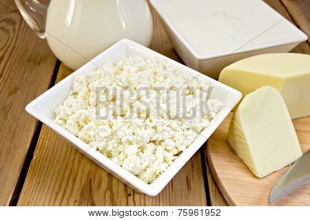 Curd with cheese and milk on board