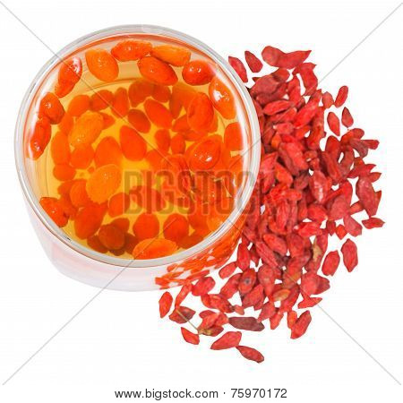 Top View Of Glass Goji Berries Infusion And Fruits