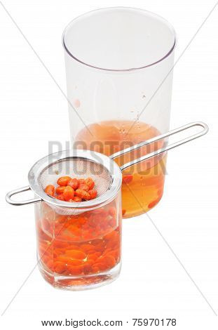 Pot And Glass With Goji Berries Infusion Isolated