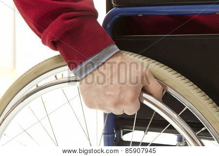 Wheelchair user makes various movements with his wheelchair, exercises for safety handling