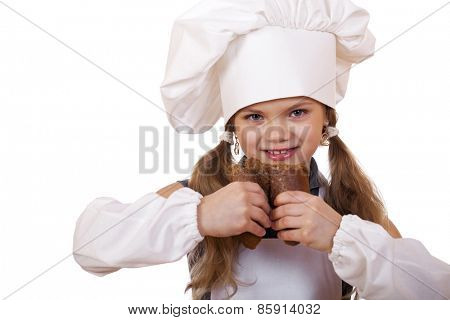 Cooking and people concept - smiling little girl in cook hat, isolated on white background