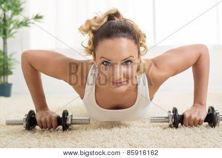 Woman Doing Exercises With Dumbbell