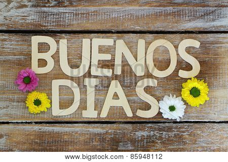 Buenos Dias (Good morning in Spanish) written with wooden letters, and Santini flowers