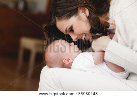 Happy mother with newborn baby