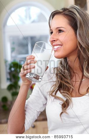 Young woman drinking milk. Health and diet.