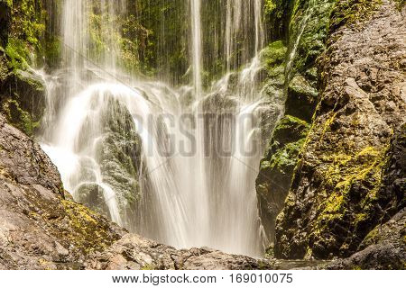 beautiful water fall in forest, new zealand, waipu, piroa falls