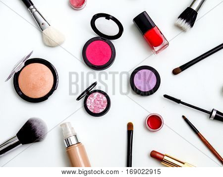 cosmetics top view on a white table. Workplace women cosmetic bag