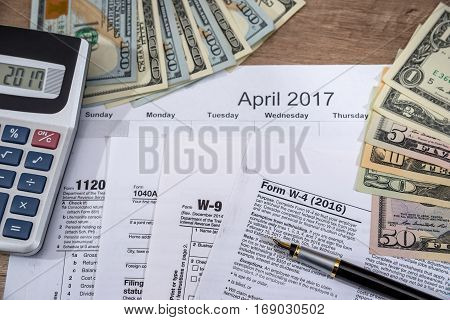 W4, W9 Tax Form With Money On Desk.