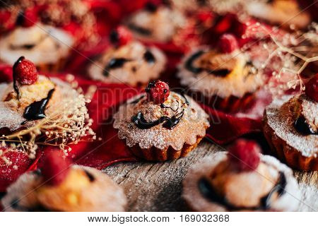 Delicious Chocolate Cupcakes With Berries On Wodeen Table, Top V