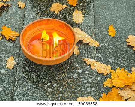 The cemetery torch burns with a bright light