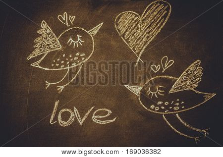 Hand drawing with chalk on blackboard, cute kawaii birds, heart and word love, template for greeting card, poster, wallpaper, St. Valentines, romantic