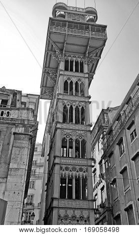 Famous gothic iron tower of the Santa Justa Lift in the Baxia district, Lisbon, Portugal. Black and white image