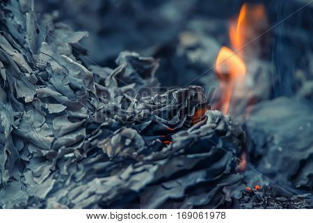 Burnig paper pages and remaining ashes and ember