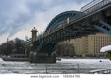 Andrew's Bridge on the River Moscow on Frunze Embankment in winter in cloudy winter weather day