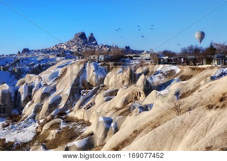 UÇHISAR CASTLE CAPPADOCIA BALLOON WINTER VIEW LANDSCAPE