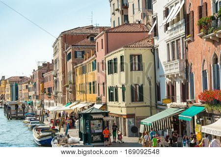 VENICE, ITALY - March 26, 2016. Beautiful view of water street and old buildings in Venice on May 26, 2015. its entirety is listed as a World Heritage Site, along with its lagoon.May 26 VENICE, ITALY