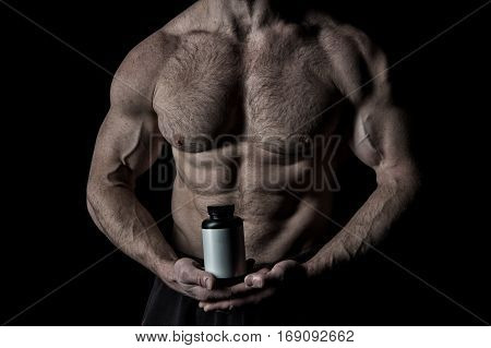 Handsome Sexy Athlete Man With Muscular Body Holds Plastic Jar Or Container