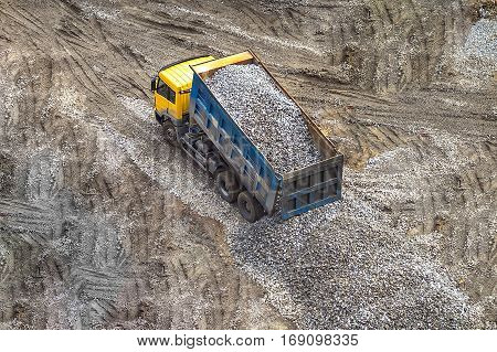 truck fully loaded with breakstone macadam rubble