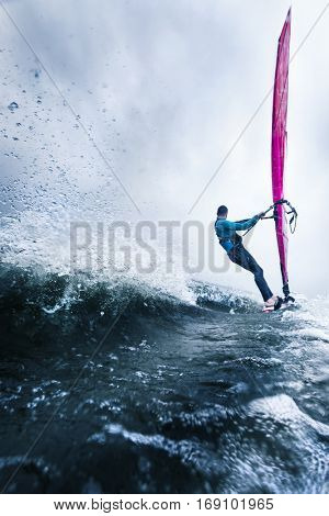 the waves of a surfer passing by at high speed hanging in the wind 