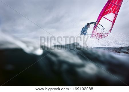 professional surfer in the waves doing tricks and stunts