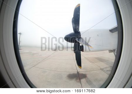 Detail of the propeller airplane at the airport. Plane motor with propeller.
