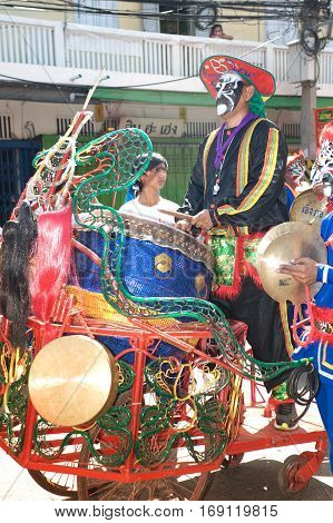 NAKHONSAWAN ,THAILAND - JANUARY 31,2017 : Unidentified fighting show of villager warriors ( Aung-Gor ) on the street in city during the Chinese New Year celebrations in Nakhonsawan Province,Middle of Thailand.