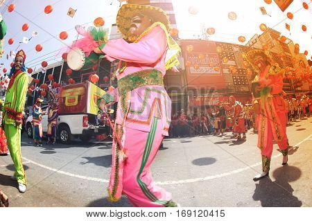 NAKHONSAWAN ,THAILAND - JANUARY 31,2017 : Unidentified fighting show of villager warriors ( Aung-Gor ) on the street in city during the Chinese New Year celebrations in Nakhonsawan Province,Middle of Thailand.
