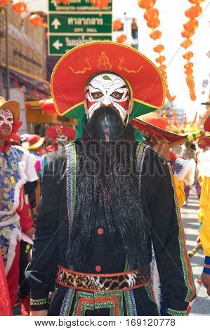 NAKHONSAWAN ,THAILAND - JANUARY 31,2017 : Unidentified fighting show of villager warriors ( Aung-Gor ) on the street in city during the Chinese New Year celebrations in Nakhonsawan Province,Middle of Thailand.