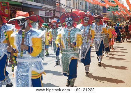 NAKHONSAWAN ,THAILAND - JANUARY 31,2017 : Unidentified fighting show of villager warriors ( Aung-Gor ) on the street in city during the Chinese New Year celebrations in Nakhonsawan Province,Middle of Thailand.