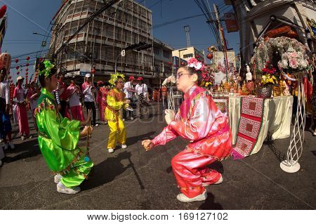 NAKORNSAWAN ,THAILAND - JANUARY 31,2017 : Unidentified young girls provide music for dance on the parade during Chinese New Year celebrations in Nakornsawan Province ,Middle of Thailand.