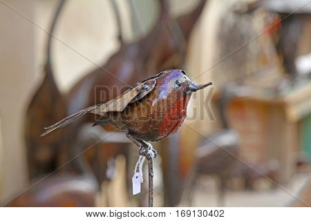 Besalu Spain - September 09 2014: Decorative bird made of metal for sale on the old street in Besalu Spain