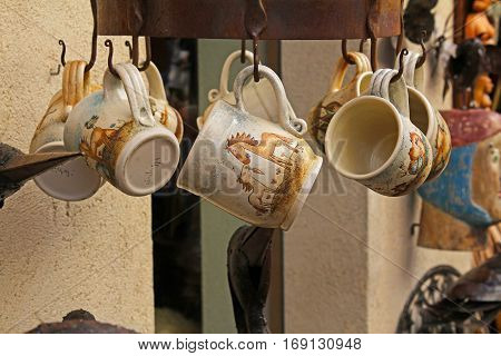 Besalu Spain - September 09 2014: Handmade ceramic mugs on street market in Besalu