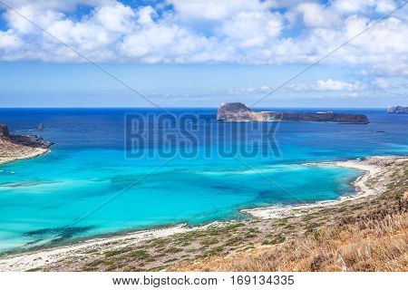 Picturesque view on Balos bay Gramvousa island and sea lagoon with clear limpid turquoise water on a bright sunny day looks like a paradise. Crete Greece.