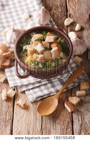 Delicious Garlic Soup With Croutons In A Bowl Close-up. Vertical
