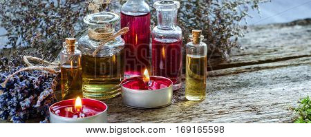 Bunch Of Dry Lavender, Candles And Bottles Of Scented Oil.