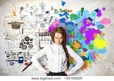 Confident young female on concrete background with mathematical formulas and colorful drawings. Creative and analytical thinking concept