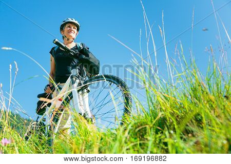 Cycling senior couple enjoying summer at the vilsalpsee in austria