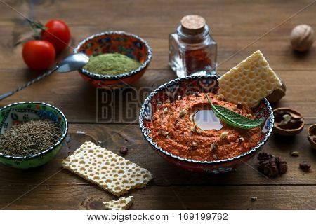 Walnuts And Pepper Dip Sauce Muhammara And Ingredients Close-up On The Table. Horizontal