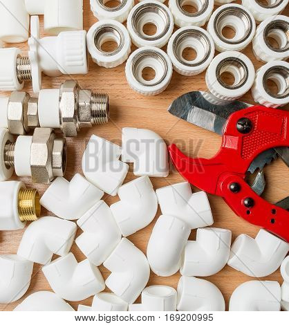 Set plumbing and tools on a white background. The fit adjustable wrench for plumbing pipes and fittings