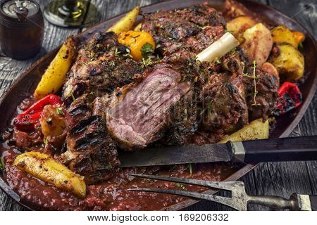 Lamb Knuckles with Fried Potatoes in Burgundy Sauce on Plate