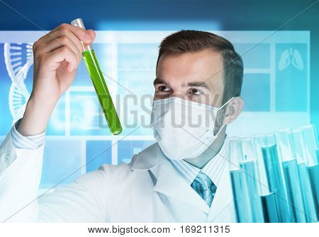 Young scientist mixing reagents in glass flask in clinical laboratory