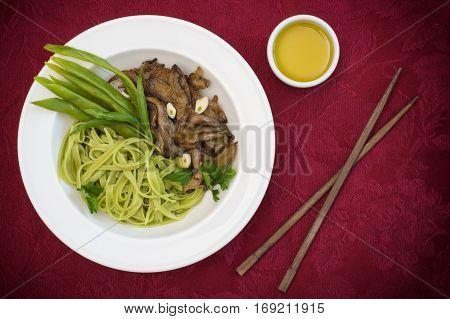 Plate Of Spaghetti Dough With Spinach And Oyster Mushrooms. Italian Cuisine, Italian Recipes. Wooden
