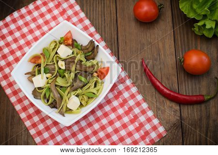 Plate Of Spaghetti Dough With Spinach And Oyster Mushrooms. Italian Cuisine, Italian Recipes. Wooden